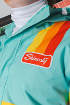 The Midday Aprés | Teal and Orange Retro Stripe One Piece Ski Suit - Shinesty