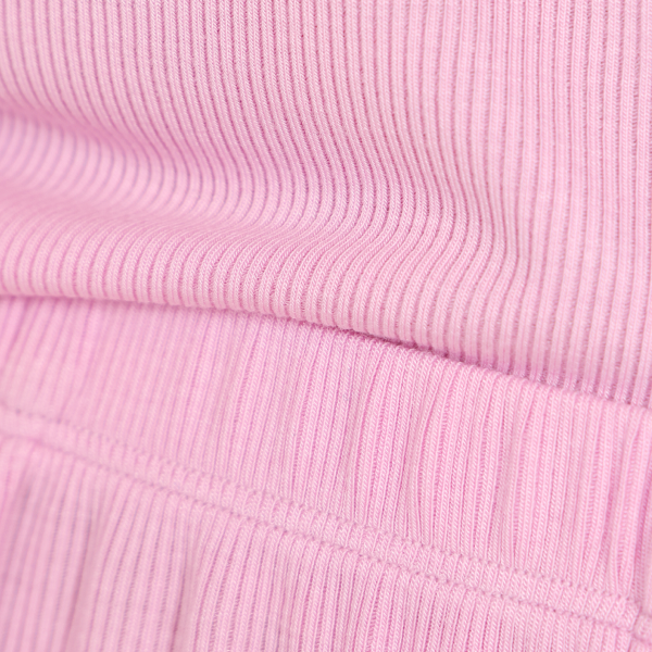 Pink ribbed MicroModal knit, every vertical rib visible, the fabric of Shinesty ribbed pajamas